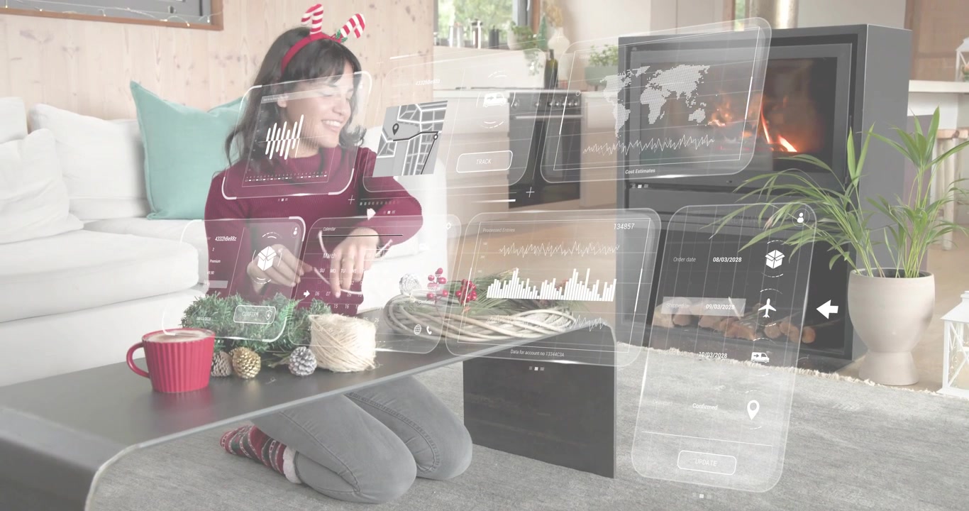 Mulher ajoelhada colocando barbante de juta, folhagens e frutas vermelhas na mesa, iniciando a montagem de uma guirlanda de Natal