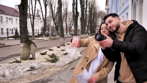 caucasian tourist couple walking through the city.