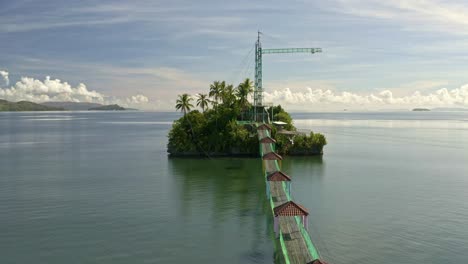 fly past drone shot of bacuag hanging bridge and octopus islet