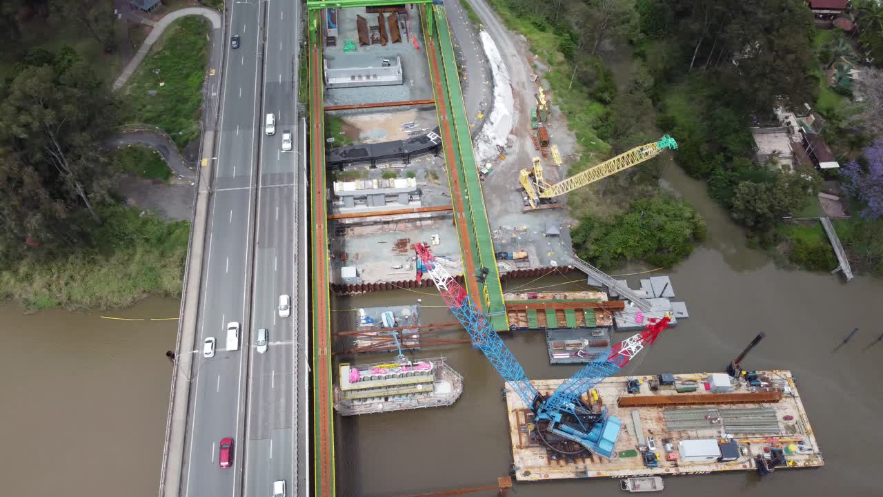 Aerial view of a new bridge construction next to an existing highway bridge