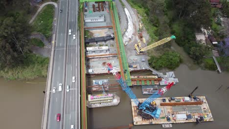 aerial view of a new bridge construction next to an existing highway bridge