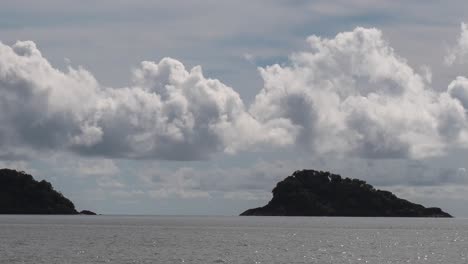 Two Islands in the Ocean Under a Cloudy Sky