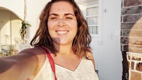 woman's santorini vacation selfie, capturing cherished memories