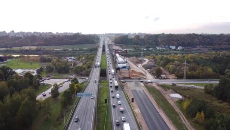 The-A1-highway-bridge-over-river-Neris-in-Kaunas,-Lithuania-in-drone-aerial-flying-forwad-shot