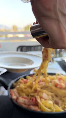 shrimp pasta dinner on a patio