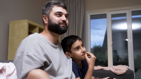 father, daughter and son in the living room at home