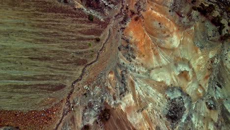 Aerial-drone-top-down-shot-over-an-open-pit-career-in-Amiandos-Asbestos-in-Cyprus-at-daytime