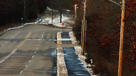 american empty street on a frozen icy day, telephoto, lowering shot, usa