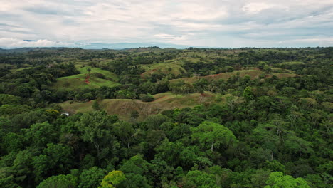 Lush-Costa-Rican-landscape-with-rolling-hills-and-dense-greenery.