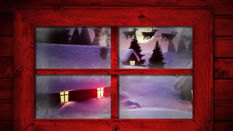 marco de ventana de madera roja contra varias casas y árboles contra la luna en el cielo nocturno