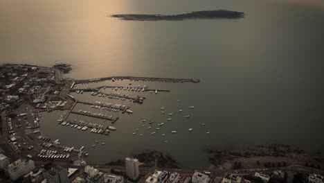 bird's eye view of the marina and gorriti island punta del este city beach in uruguay on a cloudy day