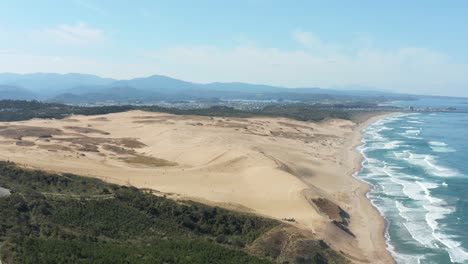 aerial establishing shot of tottori sand dunes, japan sakyu