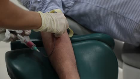 crop doctor taking blood from patient