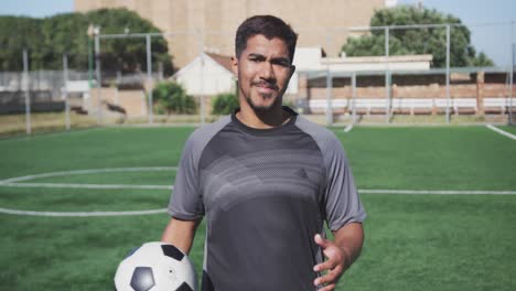 soccer player looking at camera on the field