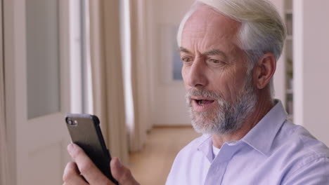 mature-man-having-video-chat-using-smartphone-enjoying-connection-grandfather-chatting-on-mobile-phone-looking-surprised