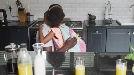 Video-of-african-american-father-and-daughter-preparing-breakfast