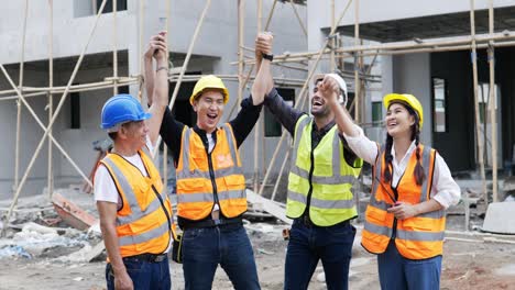 four civil engineer are hand coordination