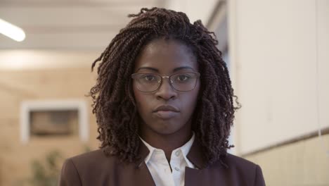 serious african american businesswoman looking at camera