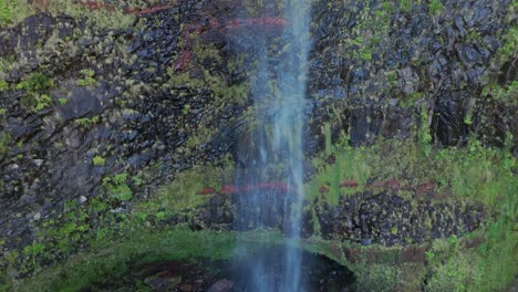 hiden waterfall in madeira forest, drone crane shot