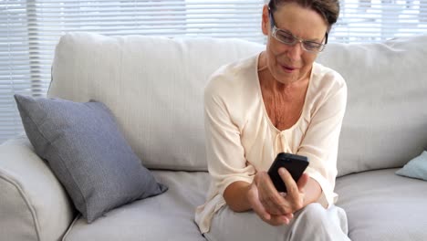 Woman-using-her-mobile-phone