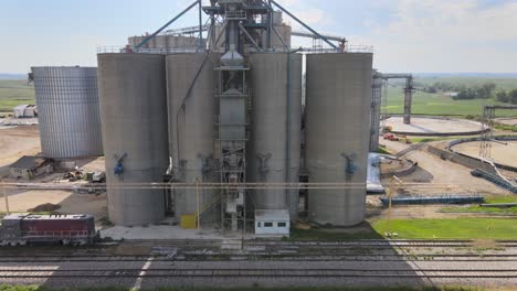 Aerial-Drone-Footage-Storm-Damaged-Grain-Elevators-Destroyed-By-High-Winds-And-Bad-Weather,-Midwest-Farm-Country,-Iowa