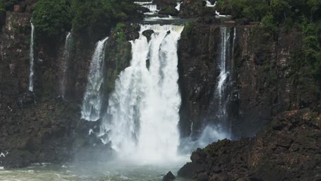 Huge-Waterfall-Stream-Running-Down-Steep-Rocky-Beautiful-Cliff,-Water-Pouring-Into-Large-Rocky-Pool,-Lots-of-Splashing-Water-From-Rough-Crashing-Waterfalls-in-Iguazu-Falls,-Brazil,-South-America