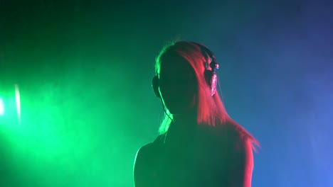 dj woman silhouette in neon lights