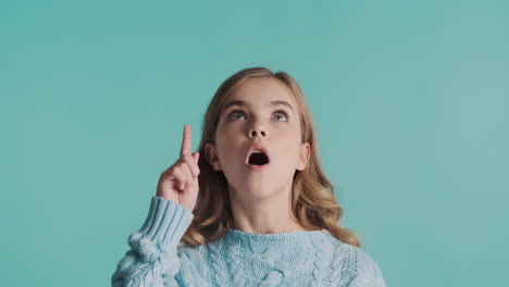 teenage caucasian girl with new idea in front of the camera.