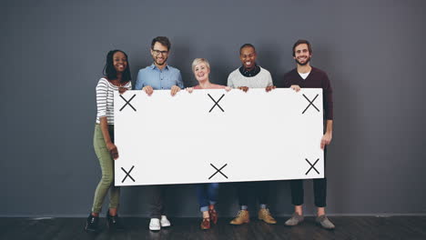 diverse group holding a blank sign