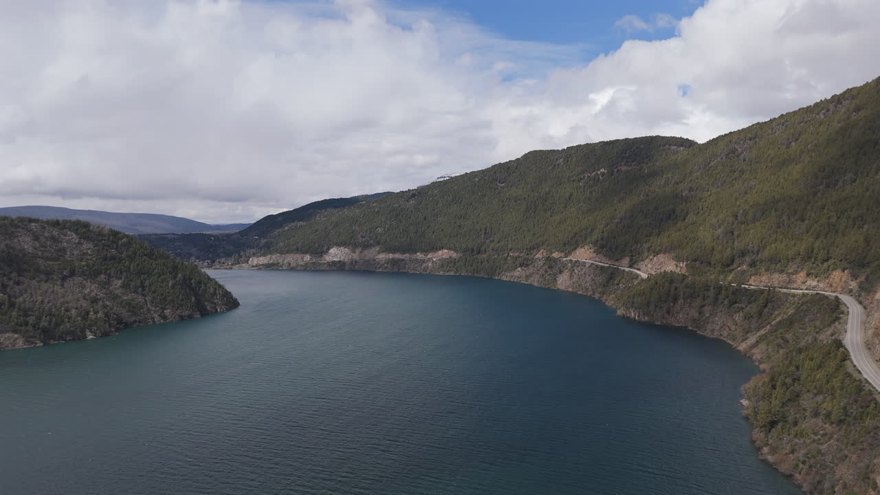 Aerial view of Lácar lake with turquoise waters and rocky mountains in San Martín de Los Andes Neuquén, Patagonia Argentina