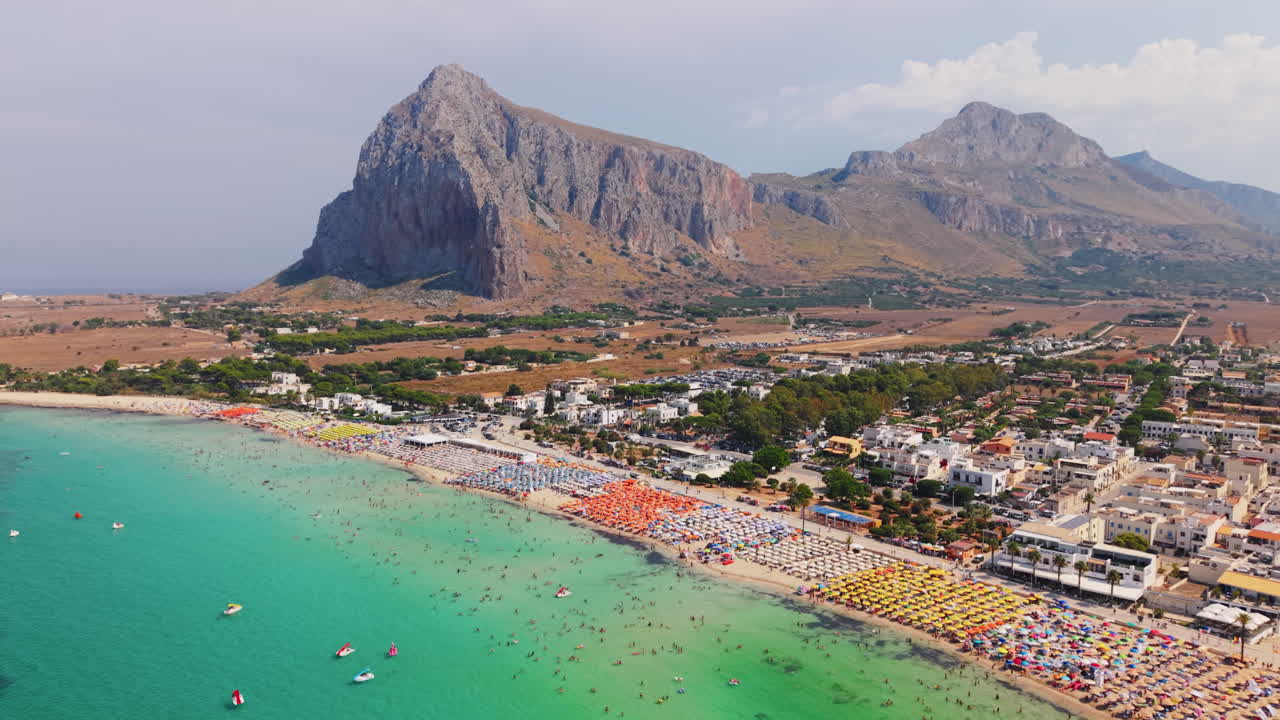 Aerial view of vibrant beach in San Vito Lo Capo, Sicily, with turquoise water