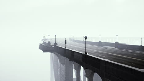 illuminated empty road bridge in a fog