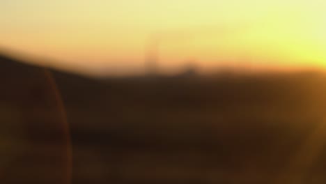 blurred sunset over industrial landscape