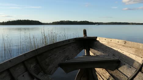 calm water and old wooden boat, nostalgic nature landscape