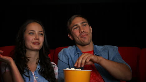 couple watching movie in cinema