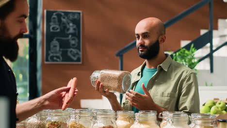 merchant showing seasonings and food