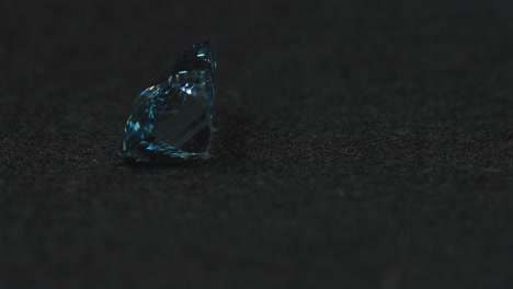 Polished-blue-gemstone-rotates-and-sparkles