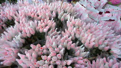 hundreds of pink petal roses are seen displayed for sale at a flower market during valentine's day