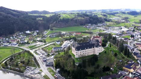 beautiful drone footage of old castle in austrian village "grein