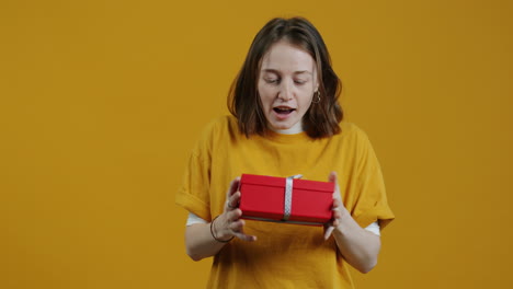 woman excitedly receiving a gift