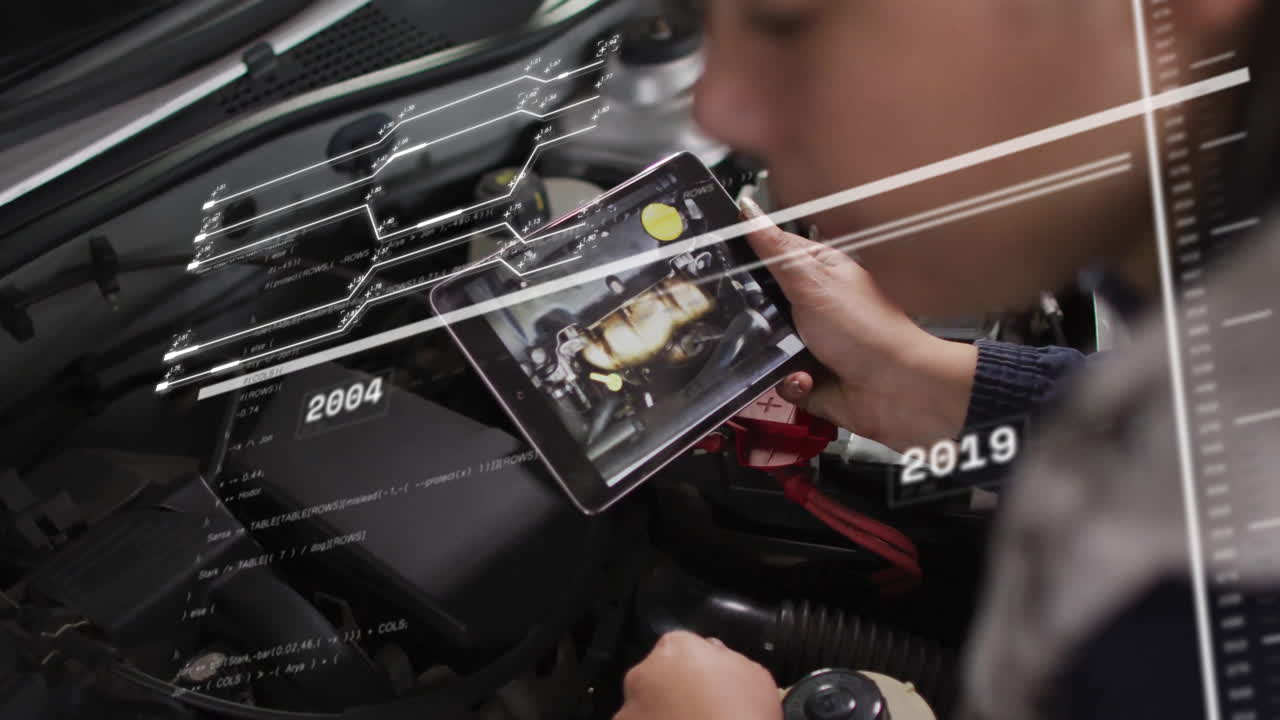 Using tablet with animation, mechanic diagnosing car engine with augmented reality