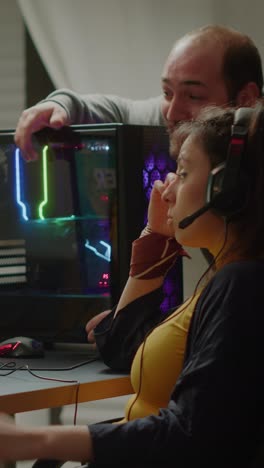 gamers reacting intensely while playing on a desktop pc