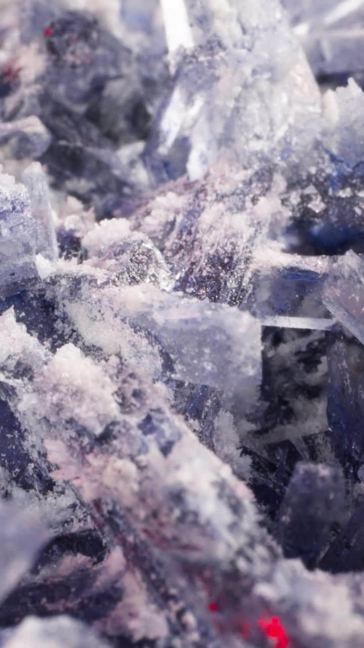 Pile of lilac organic crystals as background macro view. Home grown minerals and shiny stones in laboratory. Science lessons for junior children