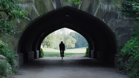 a person walks through a tunnel in prospect park in brooklyn, ny