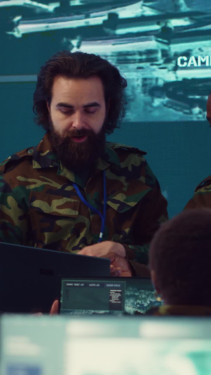 Military Officers Working in High-Tech Command Center with Surveillance Screens