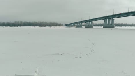huge-ice-cross-located-on-frozen-river-covered-with-snow