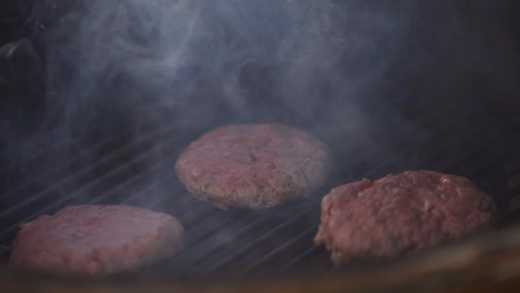 burgers being grilled on bbq