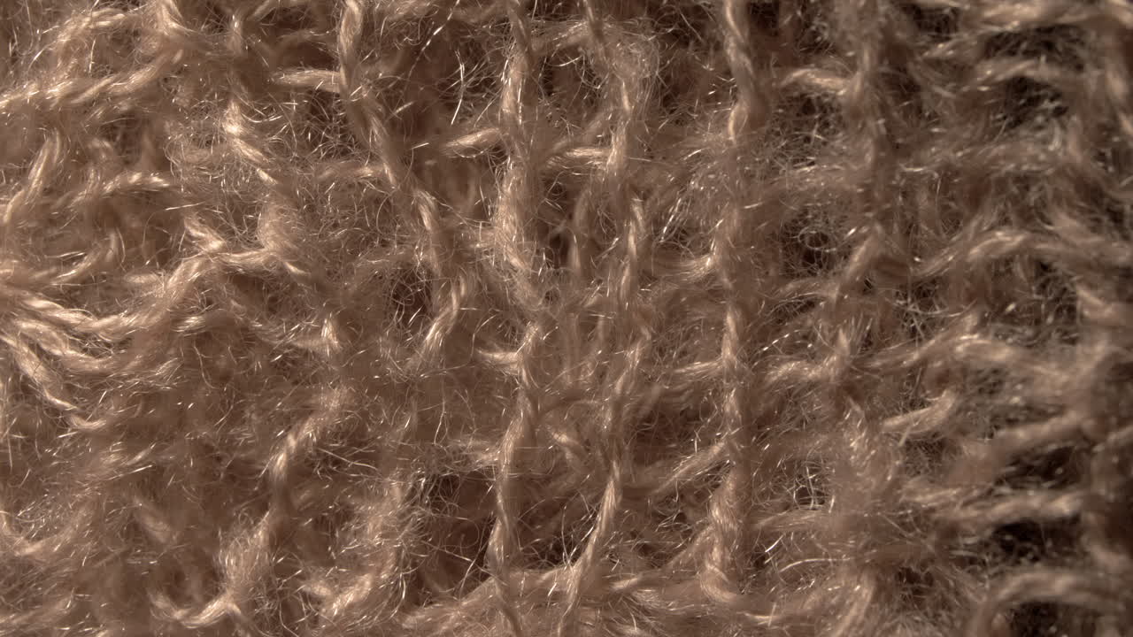 un patrón de textura de lana macro disparado de cerca, en 4k 60p 10bit, prores42 de manzana, con grabador externo de átomos