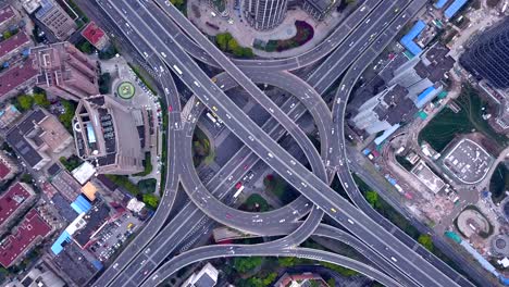 aerial view of highway junctions with roundabout. bridge roads shape circle in structure of architecture and transportation concept. top view. urban city, shanghai downtown, china.