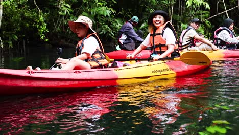 group kayaking through lush, scenic krabi canals